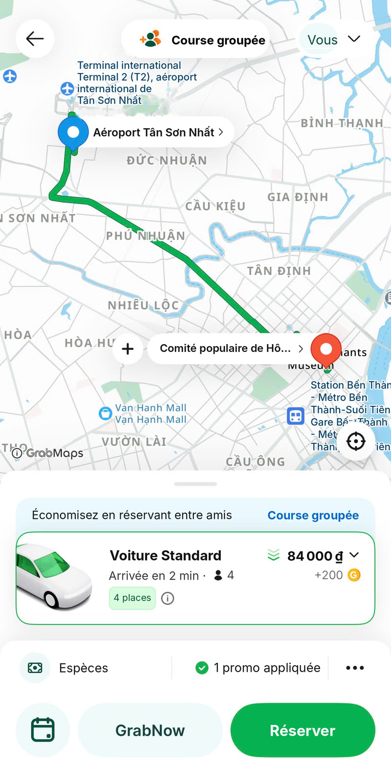 Capture d’écran de l’application Grab, traduite en français : trajet en voiture entre l’aéroport Tân Sơn Nhất et le siège du Comité populaire de Hô Chi Minh-Ville.